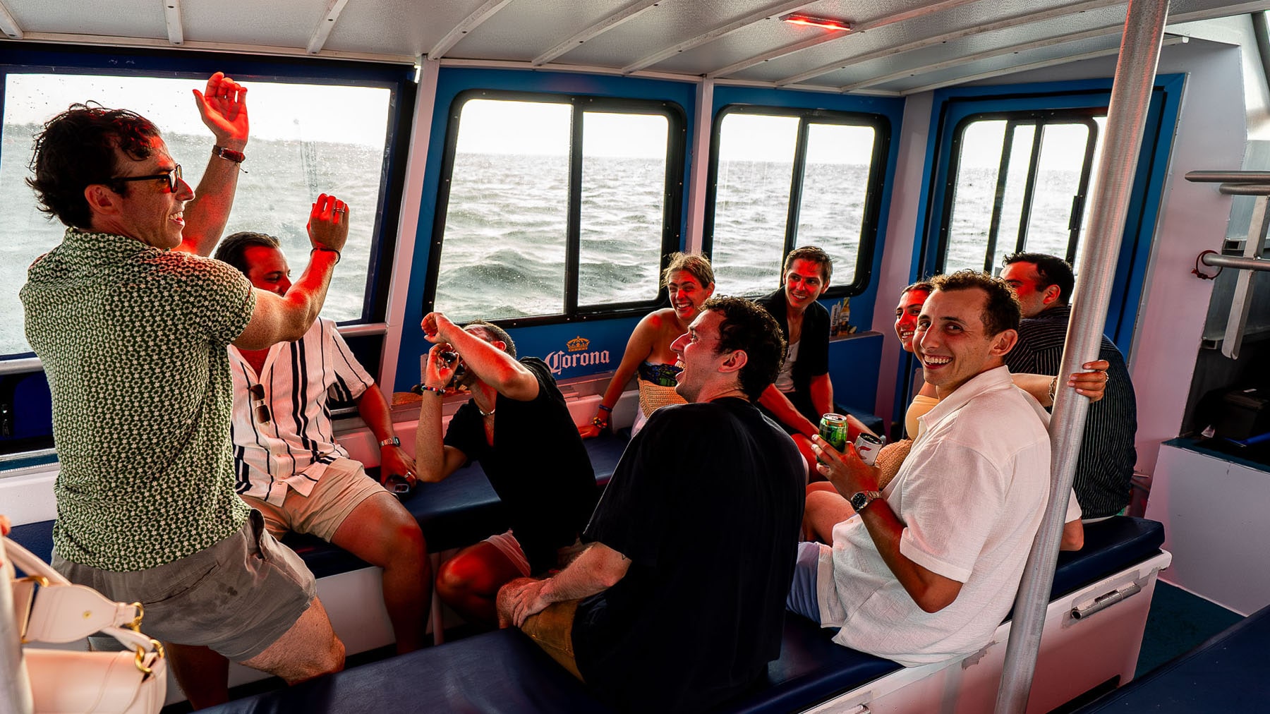 People riding inside of water taxi laughing