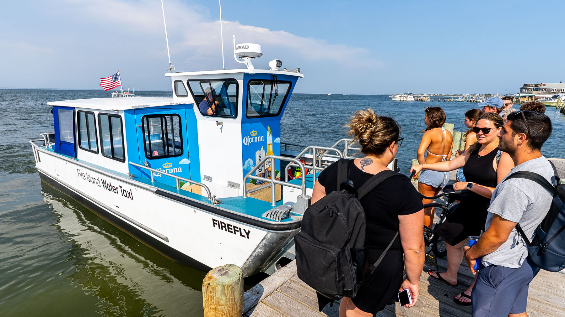People on the dock waiting to board the water taxi